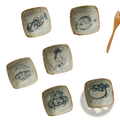 Japanese style ceramic sea creature sauce dish set with five square speckled off-white pieces and rustic brown rims