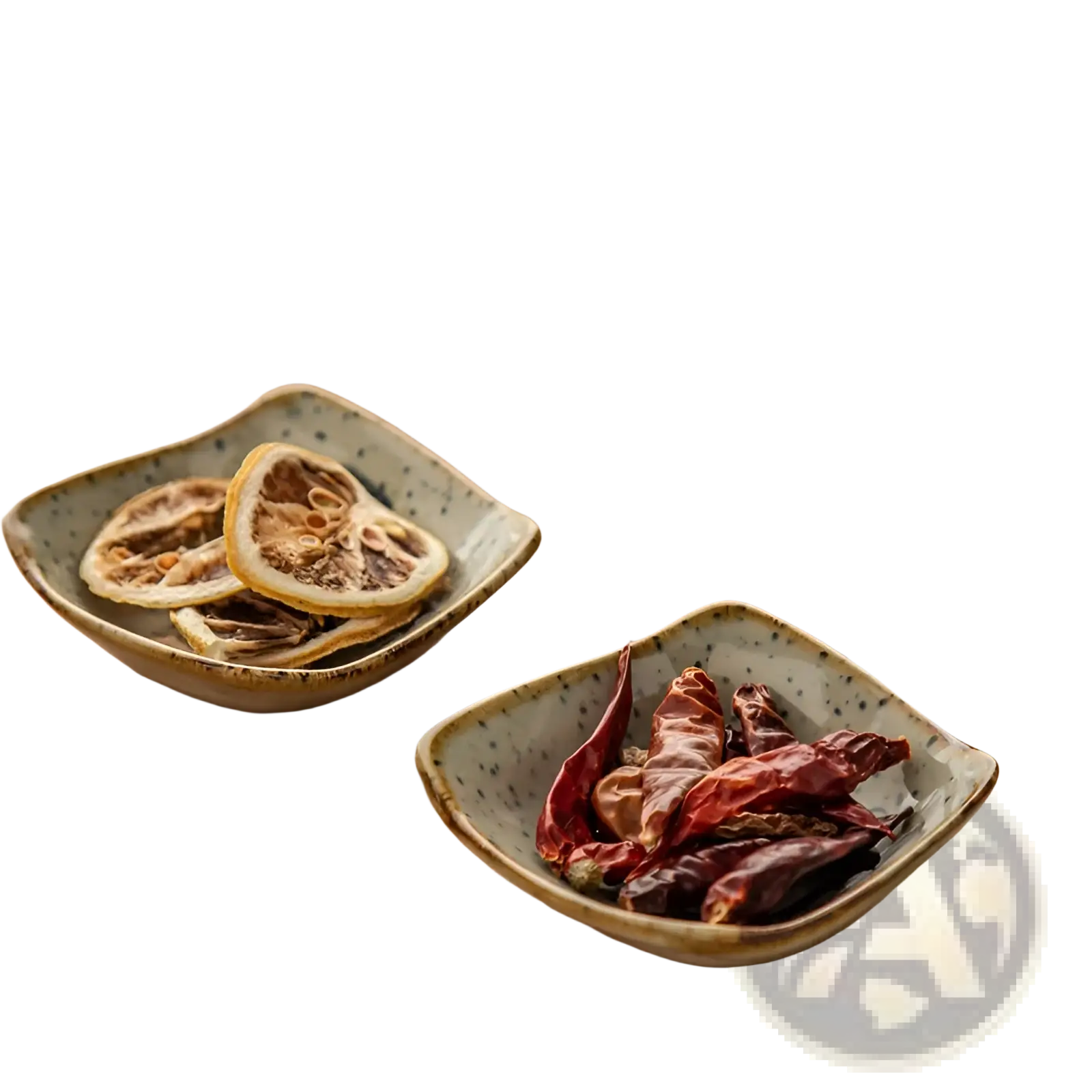 Square ceramic sea creature sauce dishes in speckled gray glaze with raised rims holding dried ingredients