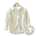 Cream-colored Japanese style cotton long sleeve shirt for men with button-up front chest pocket and rolled cuffs