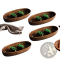 Set of four oval handcrafted wooden sushi serving plates each with two sushi pieces topped with green garnish