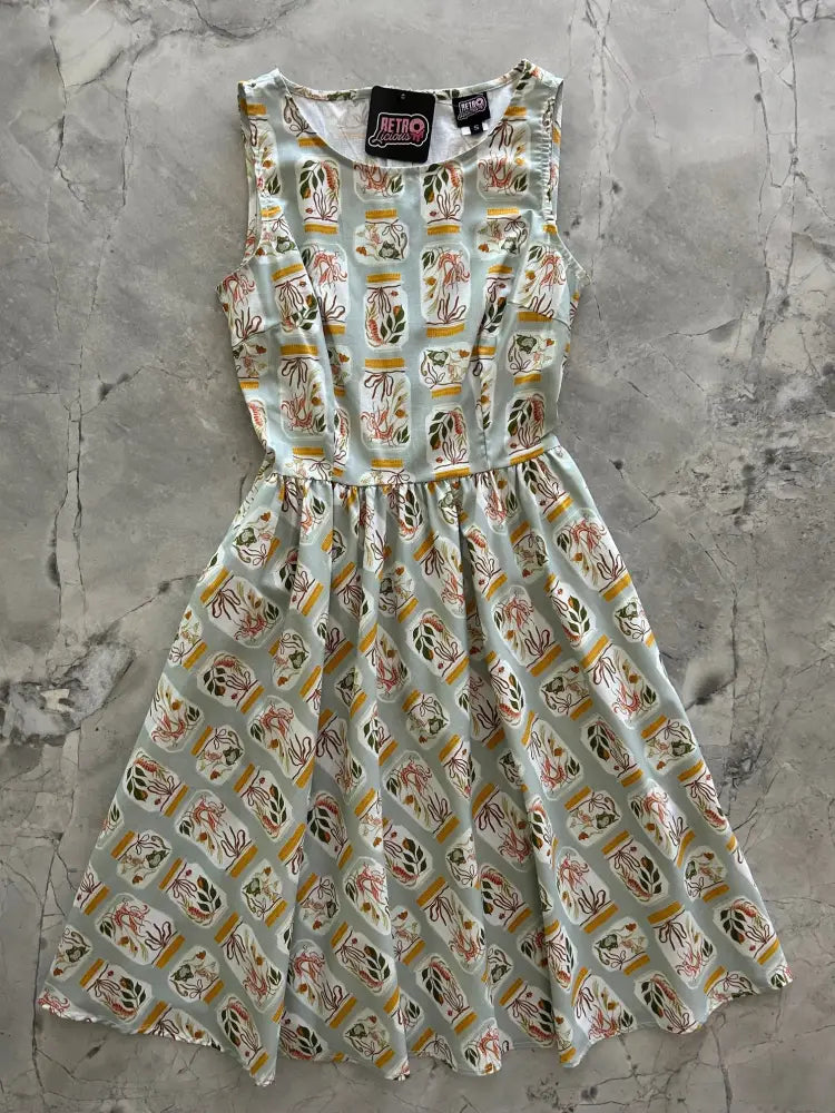 Sleeveless light mint green vintage 1950s cotton dress with jars botanical print and pockets
