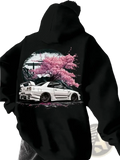 Black hoodie featuring a vibrant graphic of a white Nissan Skyline R34 with pink cherry blossoms and full moon backdrop