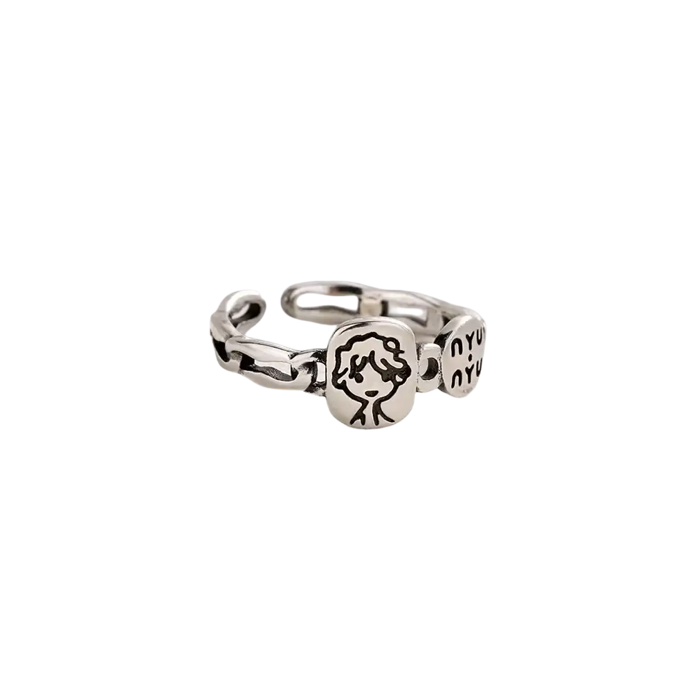 Silver adjustable sterling silver ring by jemmin featuring a cartoon face and nyu engraved on its links
