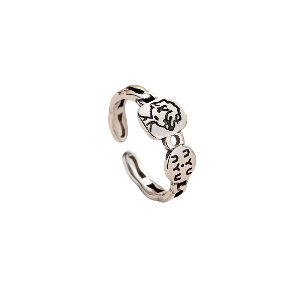 Silver adjustable open ring with two sterling silver circular charms engraved with a face and abstract symbols
