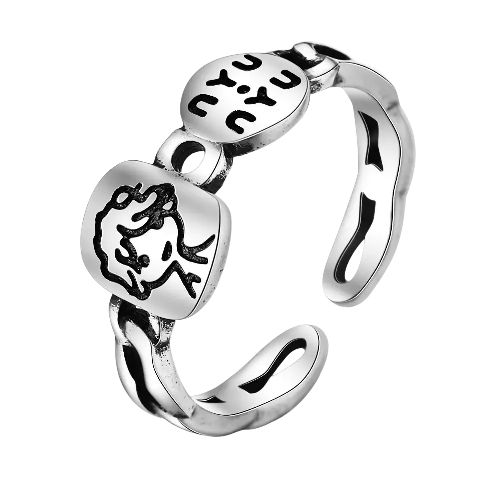 Jemmin sterling silver adjustable face ring with two oval charms featuring black engraved designs of a face and yu yu lettering