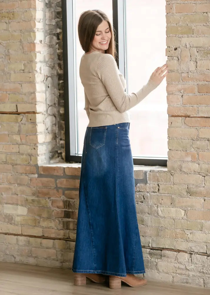 Jennifer premium a-line denim maxi skirt in blue featuring a flowing design with classic waistband and back pockets visible