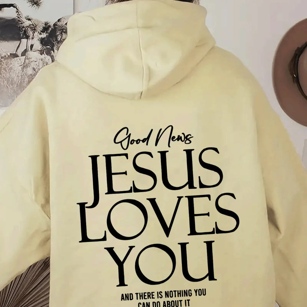 Back of cream-colored oversized streetwear hoodie with bold black good news jesus loves you text and kangaroo pocket