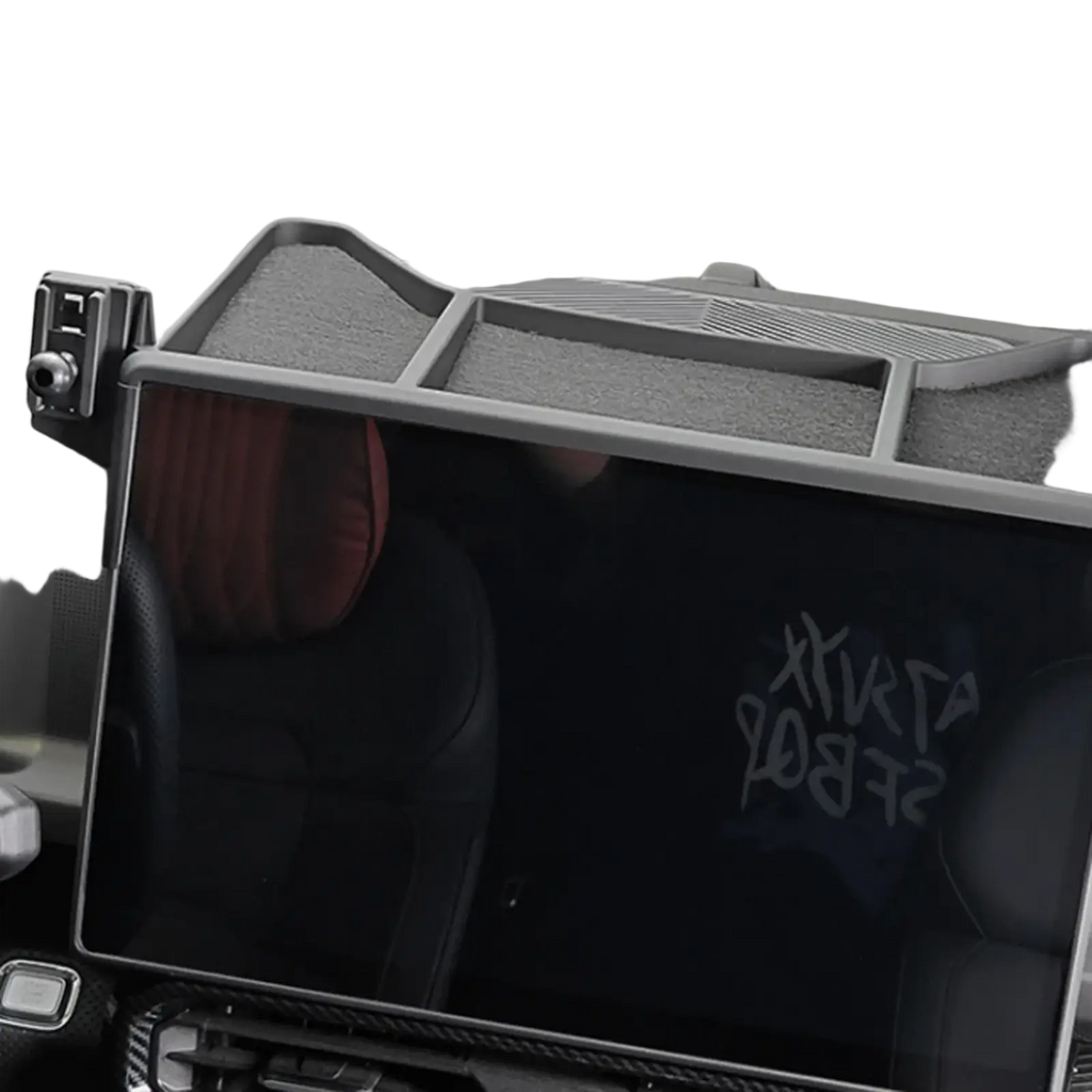 Gray plastic Jetour Traveller T2 phone holder air vent mount with multiple compartments and textured surface