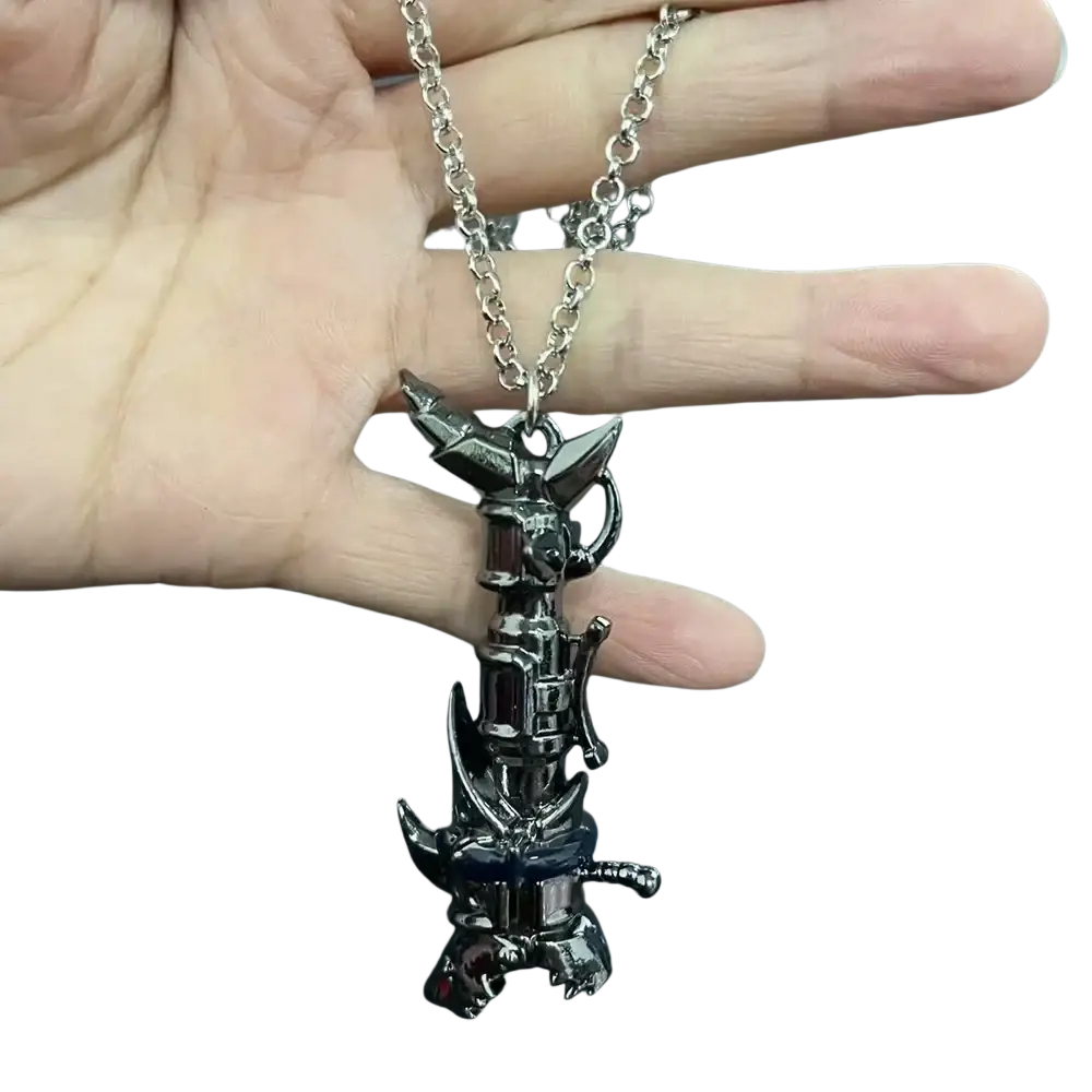 A black metallic jinx cannon anime keychain pendant shaped like a mechanical pikachu with red gemstone accents on a silver chain