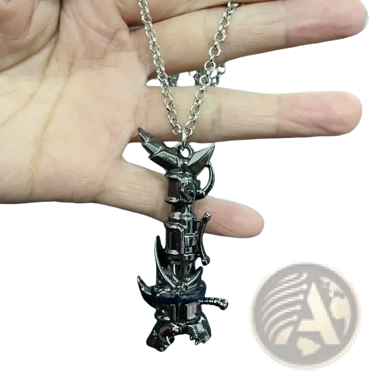 A black metallic jinx cannon anime keychain pendant shaped like a mechanical pikachu with red gemstone accents on a silver chain