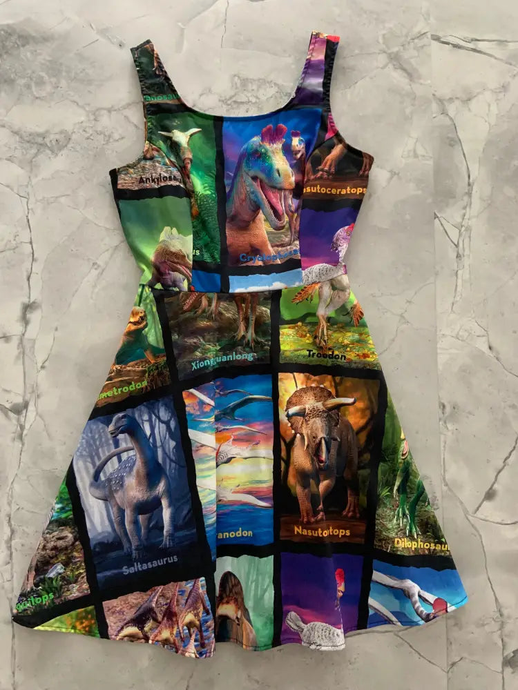 A vibrant sleeveless a-line skater dress with colorful dinosaur collage and names featuring pockets in bright colors