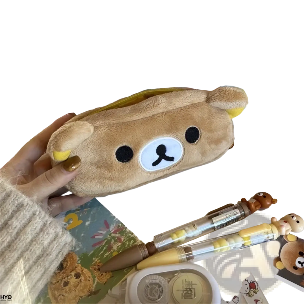 A soft tan plush pencil case shaped like rilakkuma with black button eyes and a white nose patch