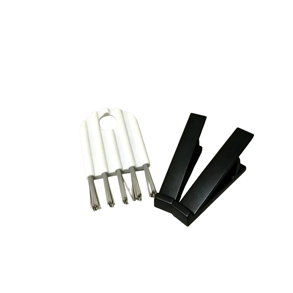 Keyboard stand and cleaning brush set featuring a white plastic and metal earbud cleaning brush with black clip organizers