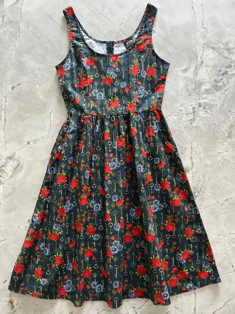 Keys and roses navy vintage fit and flare cotton dress with navy blue sleeveless design and vibrant floral key pattern