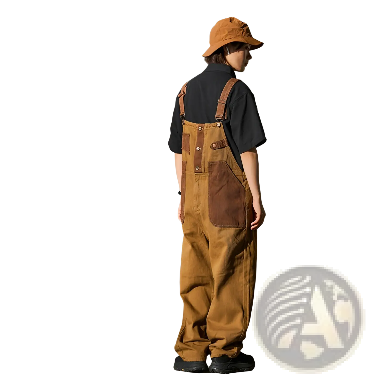 Khaki retro suspender overalls in tan corduroy with brown leather patches and straps showing the back side