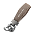 Gray textured leather kia carnival keychain with silver carnival engraving and matte black metal hardware for car keys