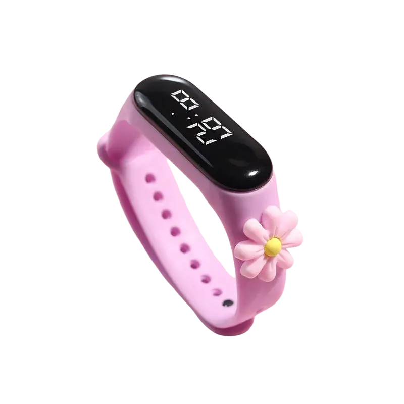 Pink silicone kids digital led watch with black display showing 07:29 and flower charm highlighting silicone material type