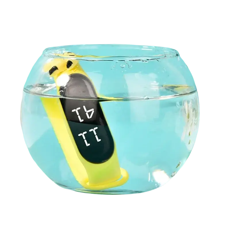 Yellow kids digital led watch made of silicone material with a black display and cartoon design submerged in water