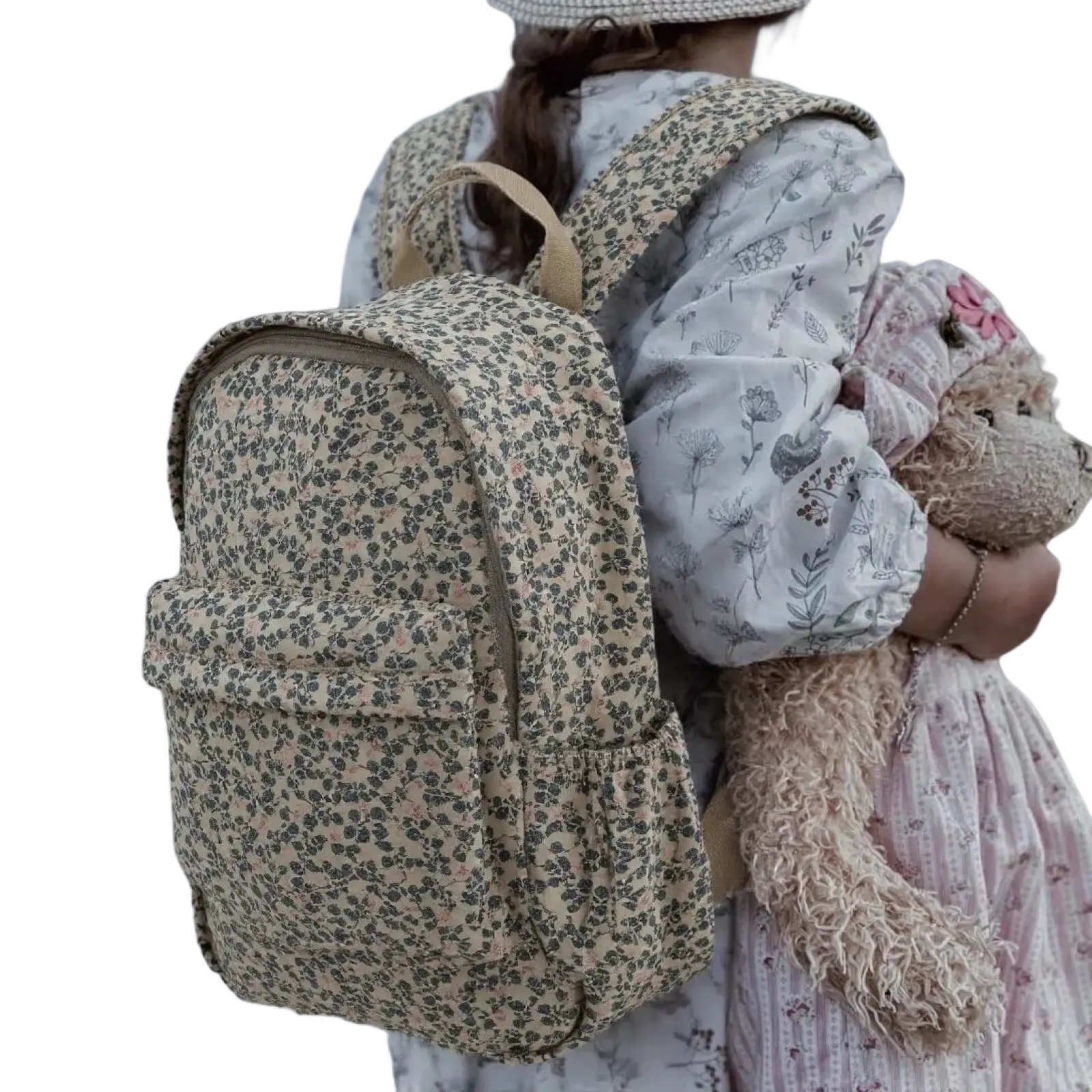 Beige floral-patterned kids dinosaur backpack with soft fabric texture and beige straps for pastel school use