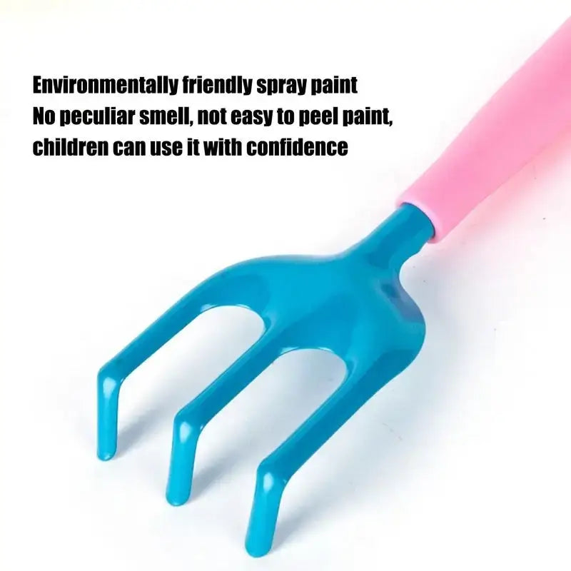 Children’s garden trowel with pink handle and bright blue plastic head from kids gardening set with tools and watering
