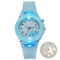 A kids glowing LED silicone sports watch in translucent light blue with a glowing face and matching strap