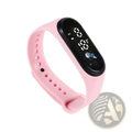 Kids led digital sports watch with pink waterproof silicone band and black digital display showing time and date