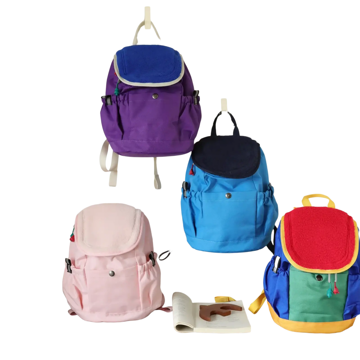 Kids lightweight fuzzy backpack in purple with blue top flap and white trim for kindergarten daypack use