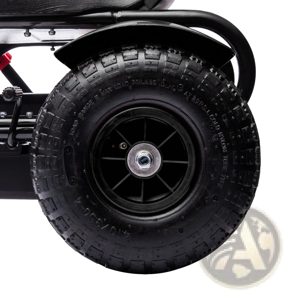Black rubber tire with deep treads mounted on a black wheel hub with silver center cap on kids pedal go kart toy