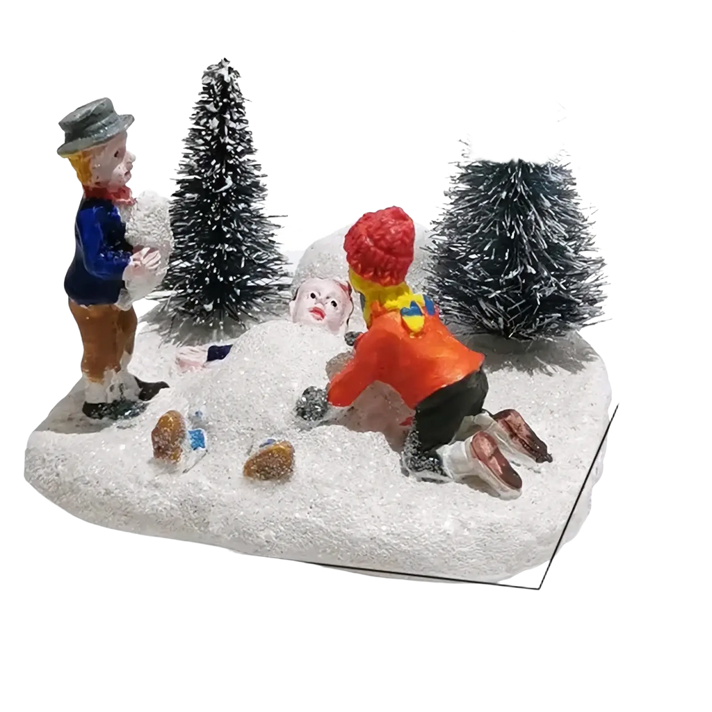 Kids playing snow Christmas village figurine set with colorful children building snowman among frosted pine trees