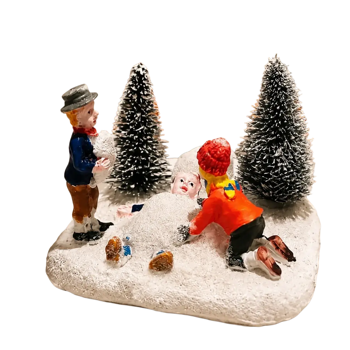 Kids playing snow Christmas village figurine set with three winter-clad characters and snow-covered trees on base