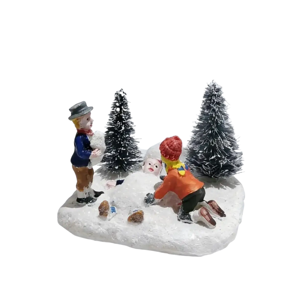 Kids playing snow christmas village figurine set with two children, snowman, tiny trees, and houses on a snowy base