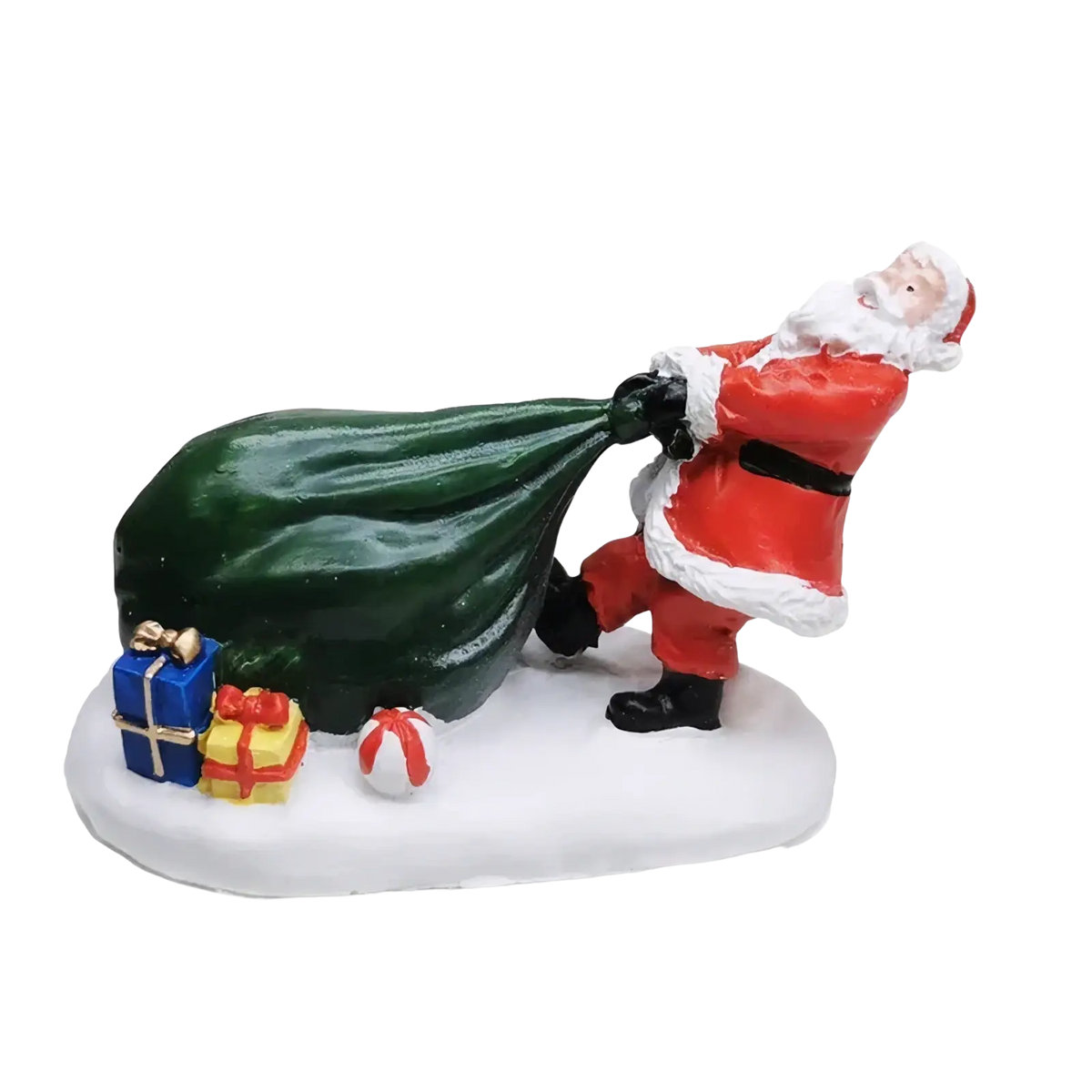 Kids playing snow christmas village figurine of red and white santa claus carrying green sack on snowy base with gifts