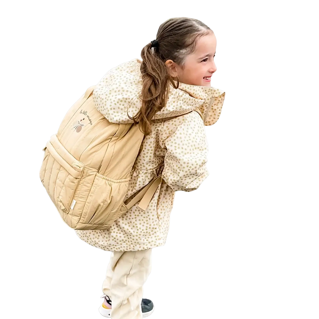 Beige kids quilted waterproof school backpack with subtle floral pattern and small embroidered logo on front