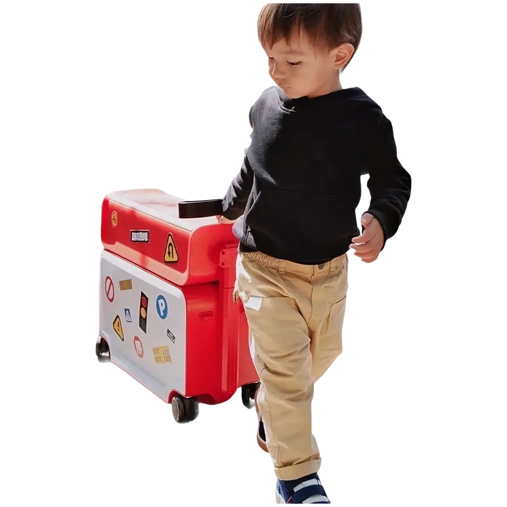 Red and white kids ride on rolling luggage carry on suitcase with colorful stickers for children’s travel use