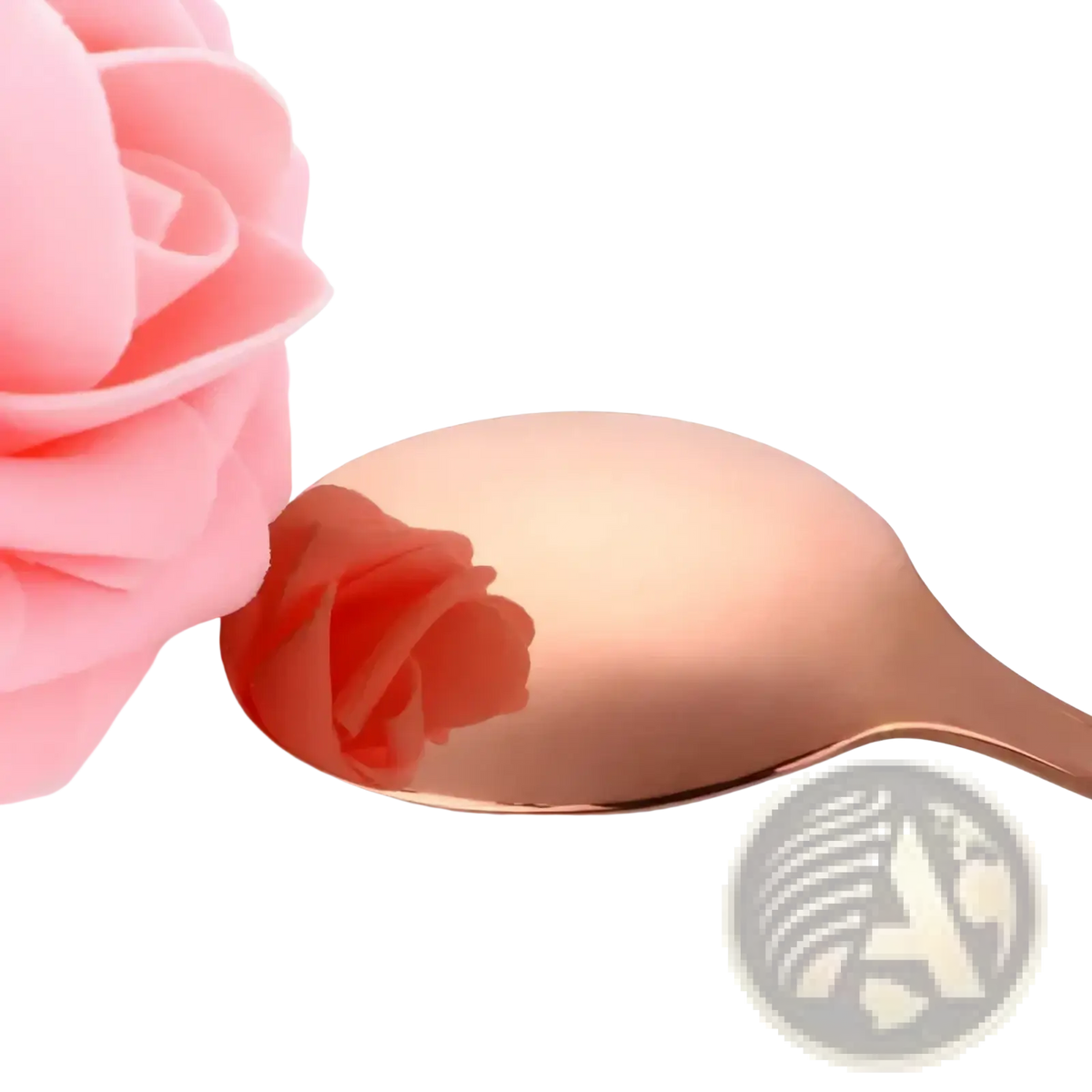 A rose gold stainless steel spoon with a smooth reflective surface from a kids flatware set