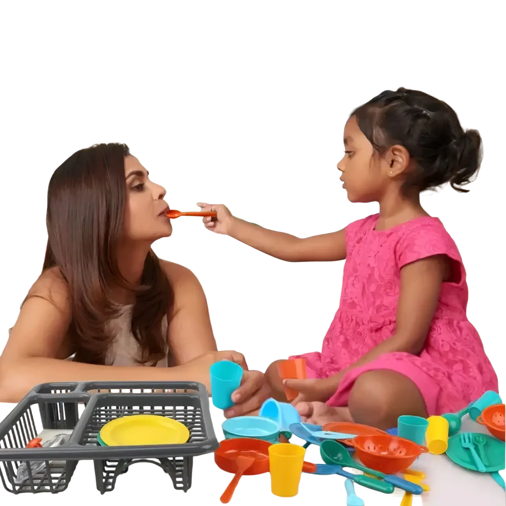 Pink lace dress displayed alongside a kids toy kitchen tableware set with dish rack for imaginative play