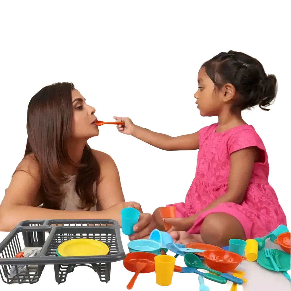 Pink lace dress displayed alongside a kids toy kitchen tableware set with dish rack for imaginative play