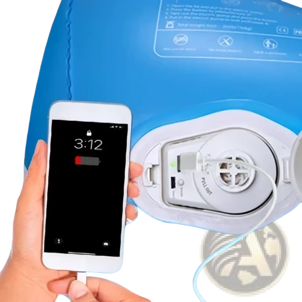 A white smartphone with low battery charging via a white cable connected to a blue kids travel air mattress inflatable car bed