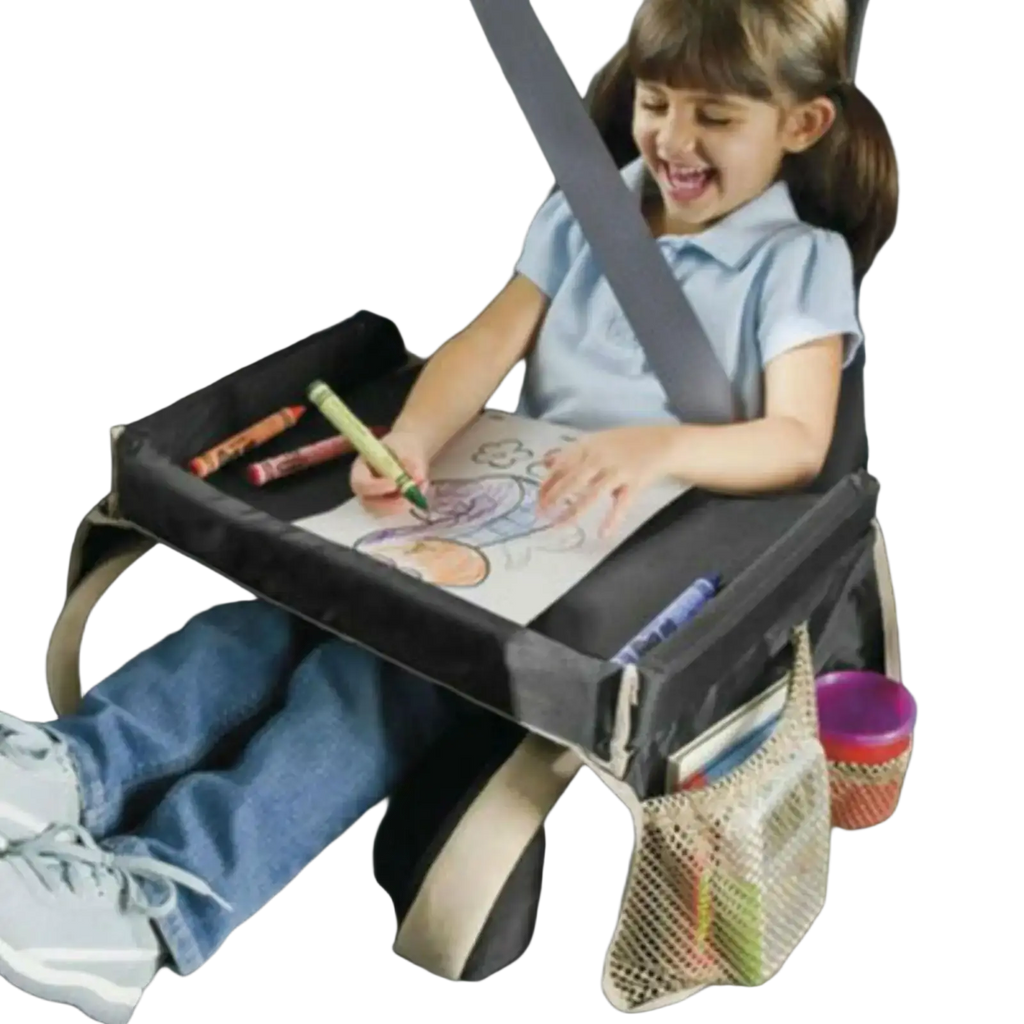 Black fabric kids travel tray for car and airplane with mesh side pockets and beige straps shown from back side