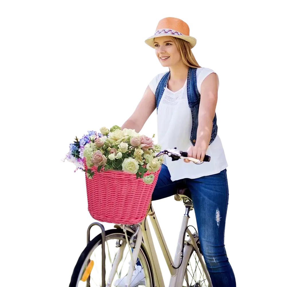 Kids woven bicycle basket set in pink featuring a woven design filled with a bouquet of pastel flowers