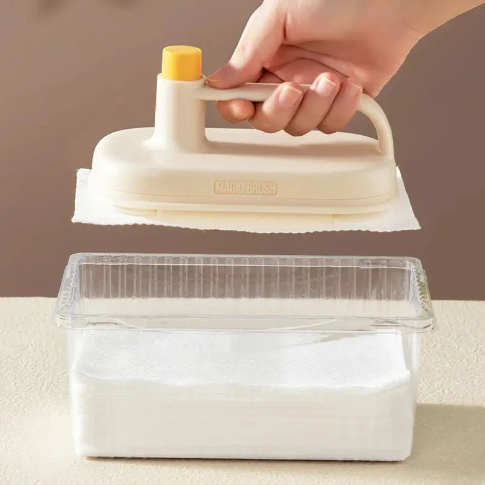 Cream-colored handheld steam iron with yellow knob and transparent water tank for arbaglobal multi-surface scrub brush