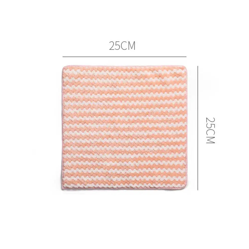 A 25cm by 25cm super absorbent coral fleece kitchen cleaning cloth with a soft pink and white zigzag textured pattern