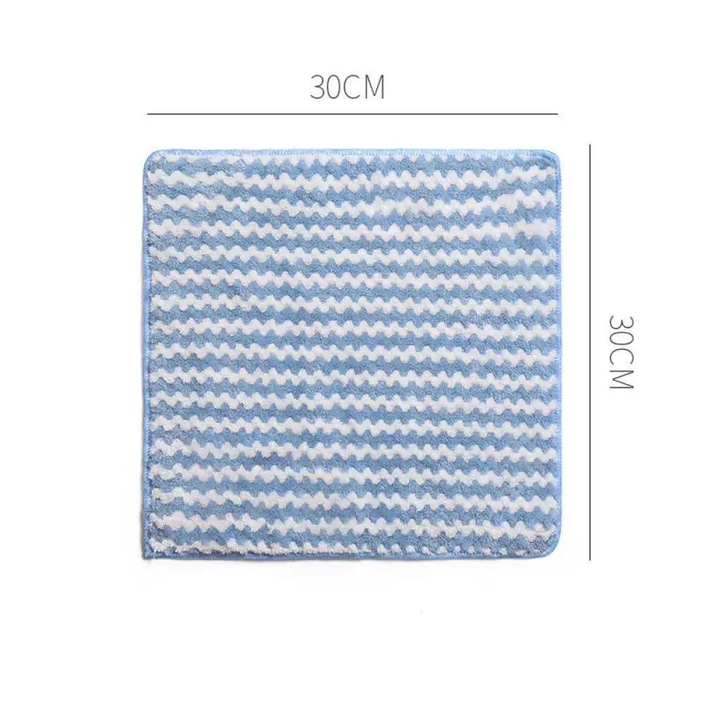A 30cm by 30cm super absorbent coral fleece kitchen cleaning cloth with a blue and white zigzag microfiber pattern