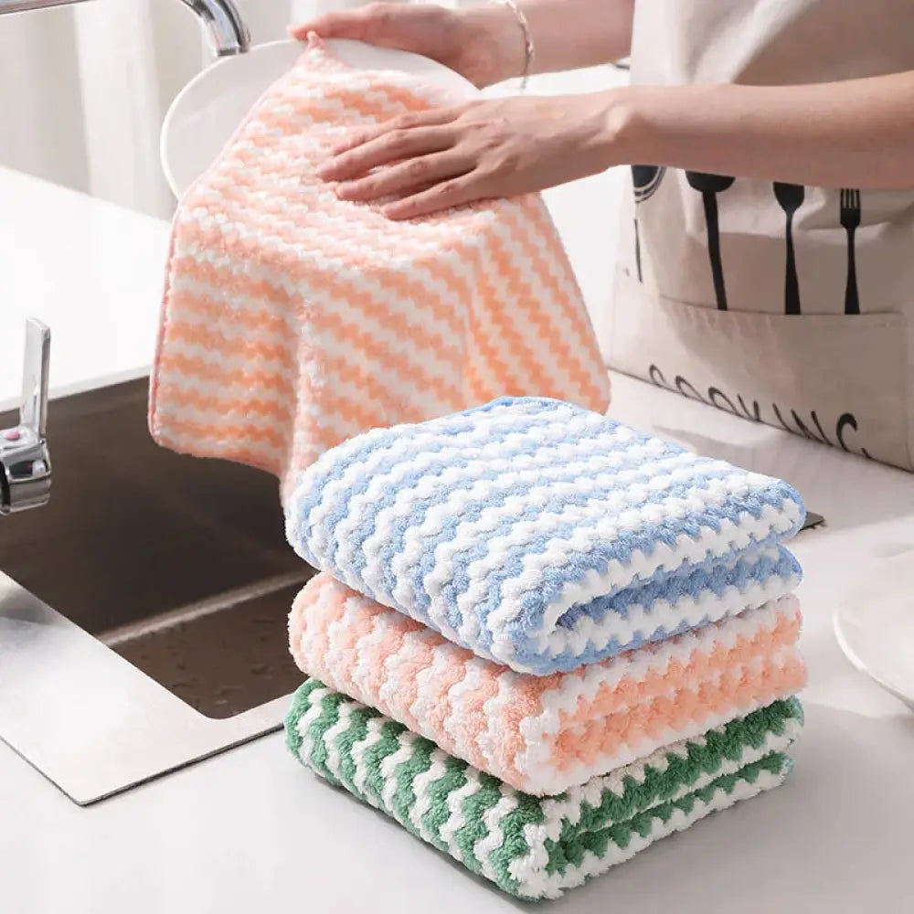 A stack of soft pastel colored super absorbent striped coral fleece kitchen cleaning cloths with a textured zigzag pattern