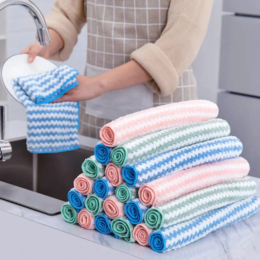 A stack of super absorbent striped coral fleece kitchen cleaning cloths in pastel colors made of microfiber