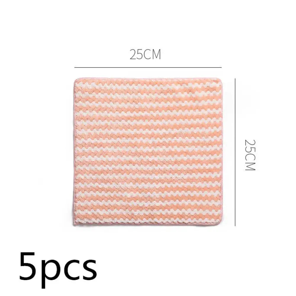 A 25cm by 25cm super absorbent coral fleece kitchen cleaning cloth with a soft pink and white zigzag pattern