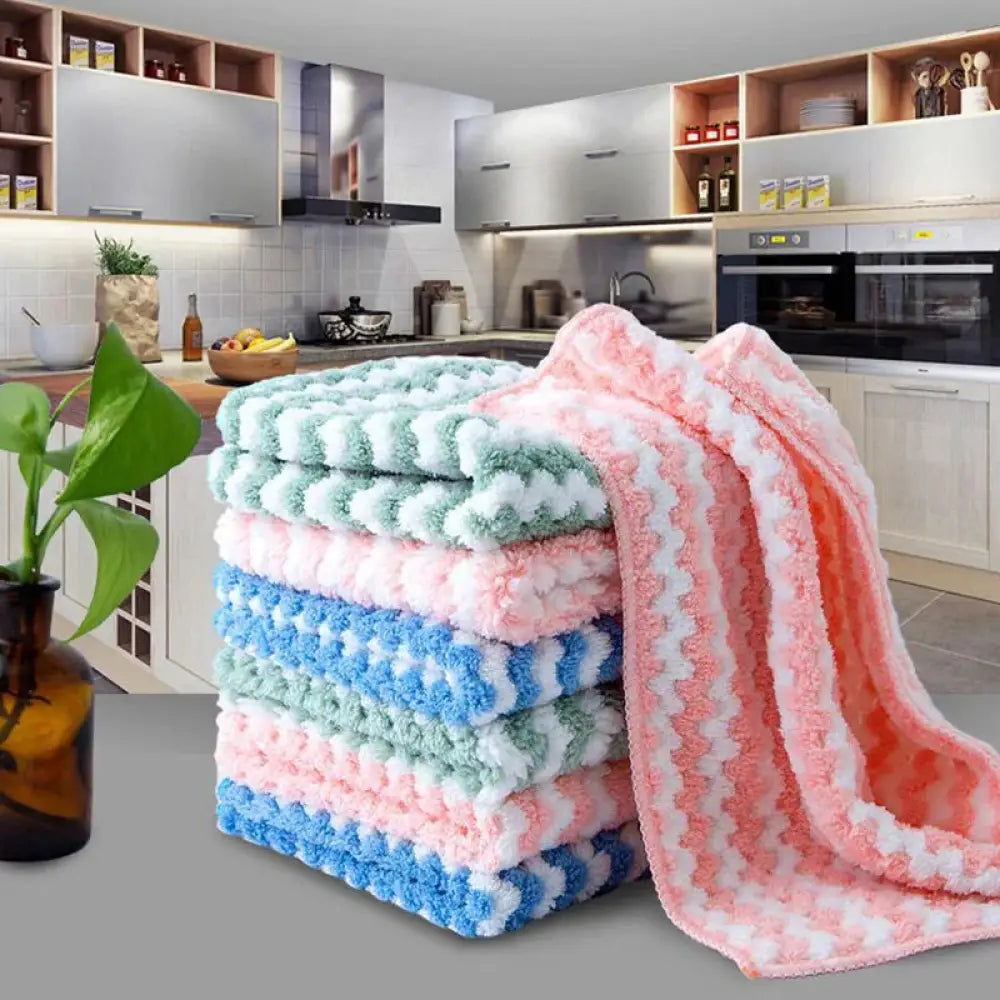 Stack of super absorbent striped coral fleece kitchen cleaning cloths in soft pastel colors with a fuzzy textured surface