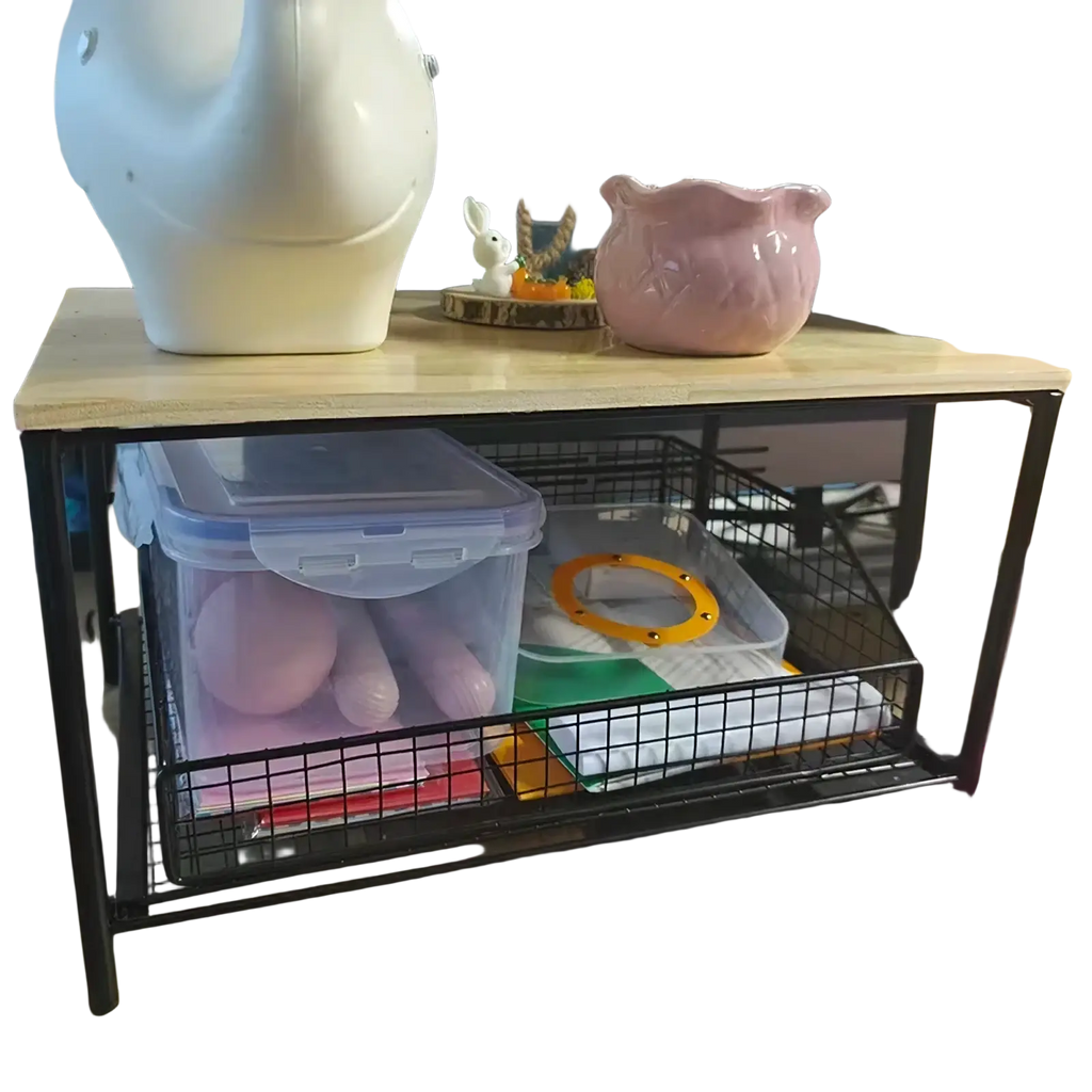 Black metal-framed kitchen countertop organizer with light wood top and wire mesh pull-out storage basket