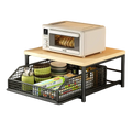 Black metal wire mesh kitchen countertop organizer with pull-out storage basket and wooden top surface