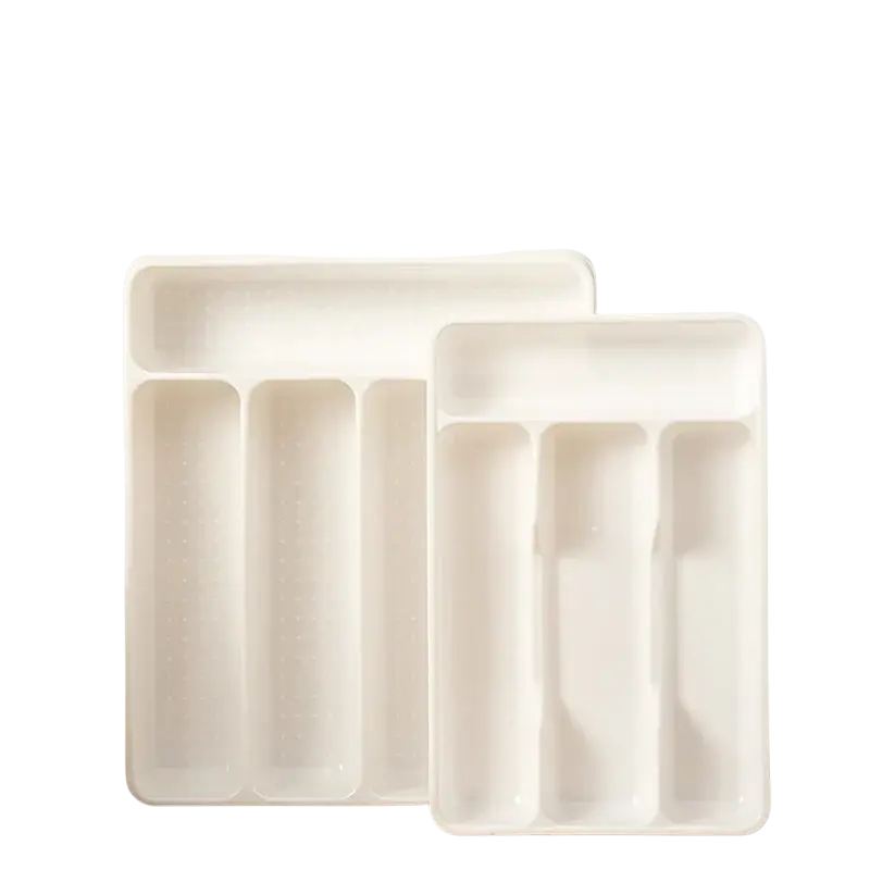 White plastic kitchen drawer adjustable utensil organizer tray with four compartments and textured surface